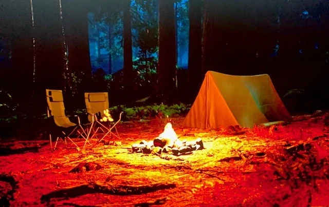 camp mode screen up close showing tent and fire